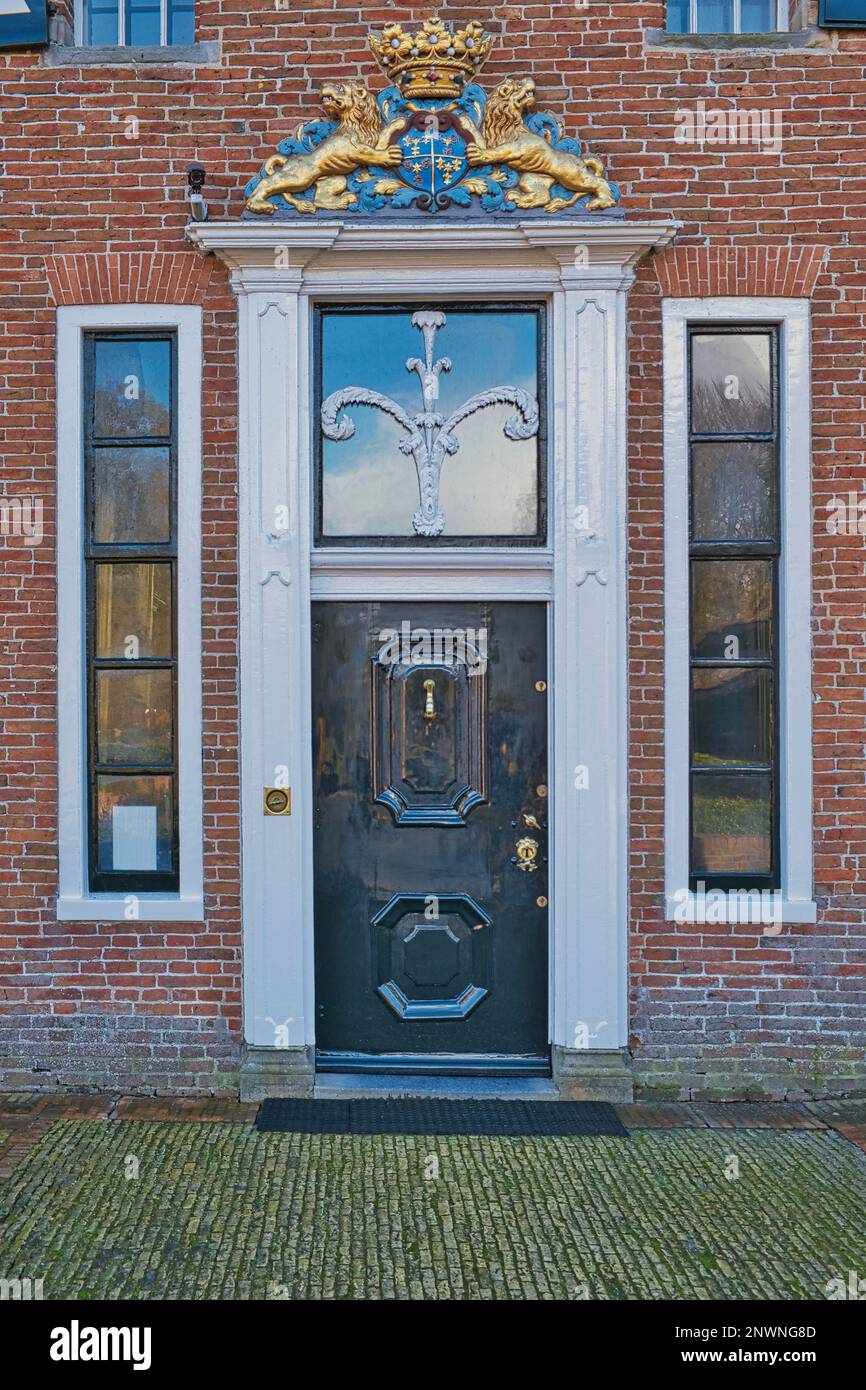 Entrance to the manor Menkemaborg, Uithuizen, Groningen, with stylised tree of life and heraldic coat of arms Stock Photo