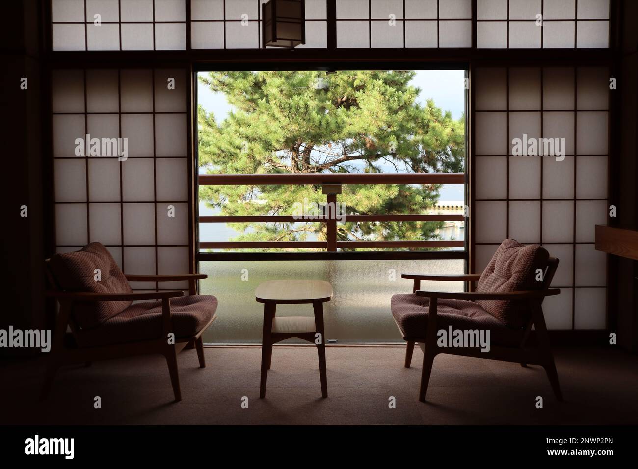 Pine trees in a Japanese style hotel room window in Miyajima island, Hiroshima, Japan Stock Photo