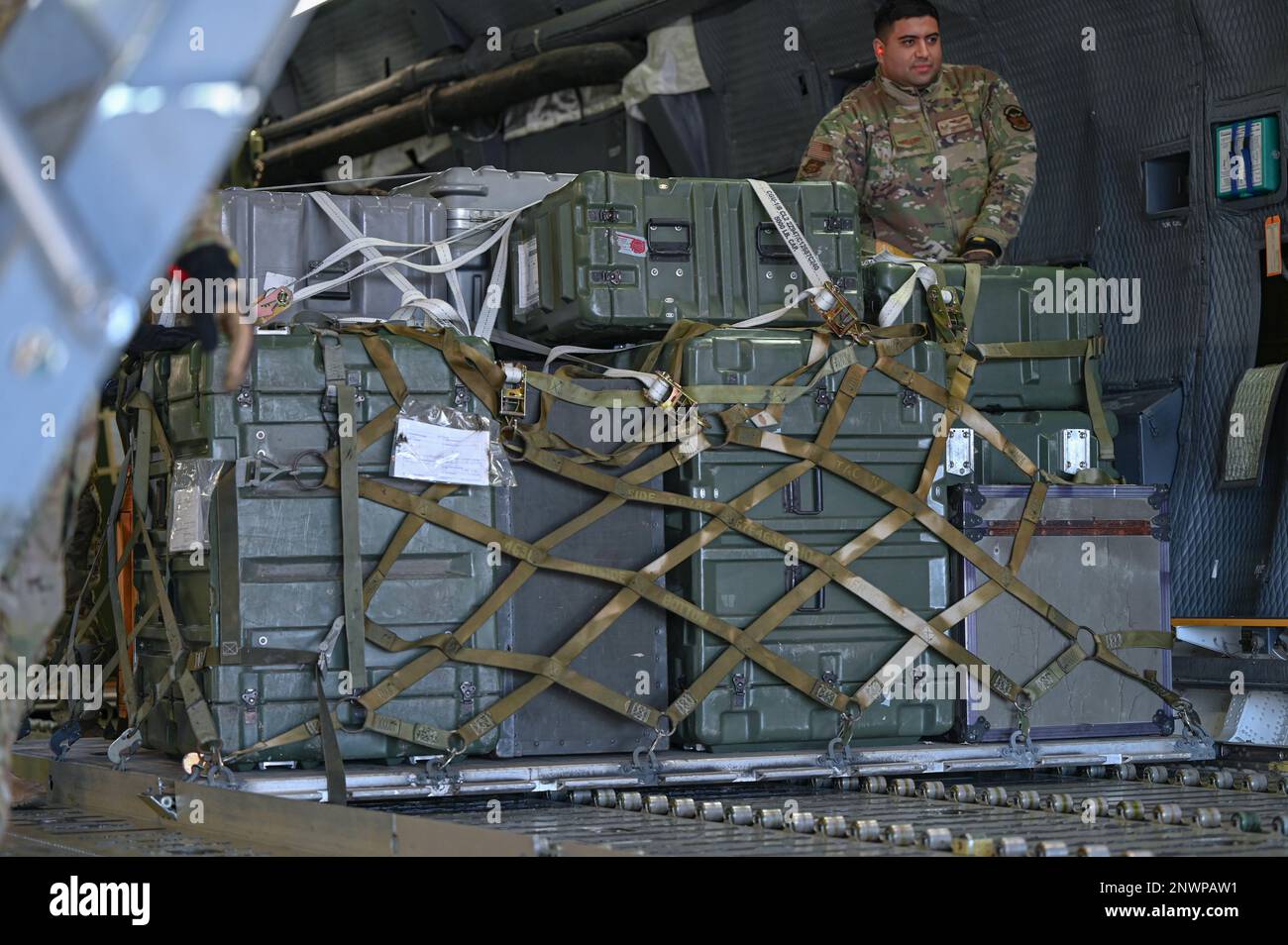 U.S. Air Force Staff Sgt. Sebastian Romero with the 312th Airlift Squadron,  pushes a pallet full of cargo from the back of a C-5M Super Galaxy at  Maxwell Air Force base, Alabama,