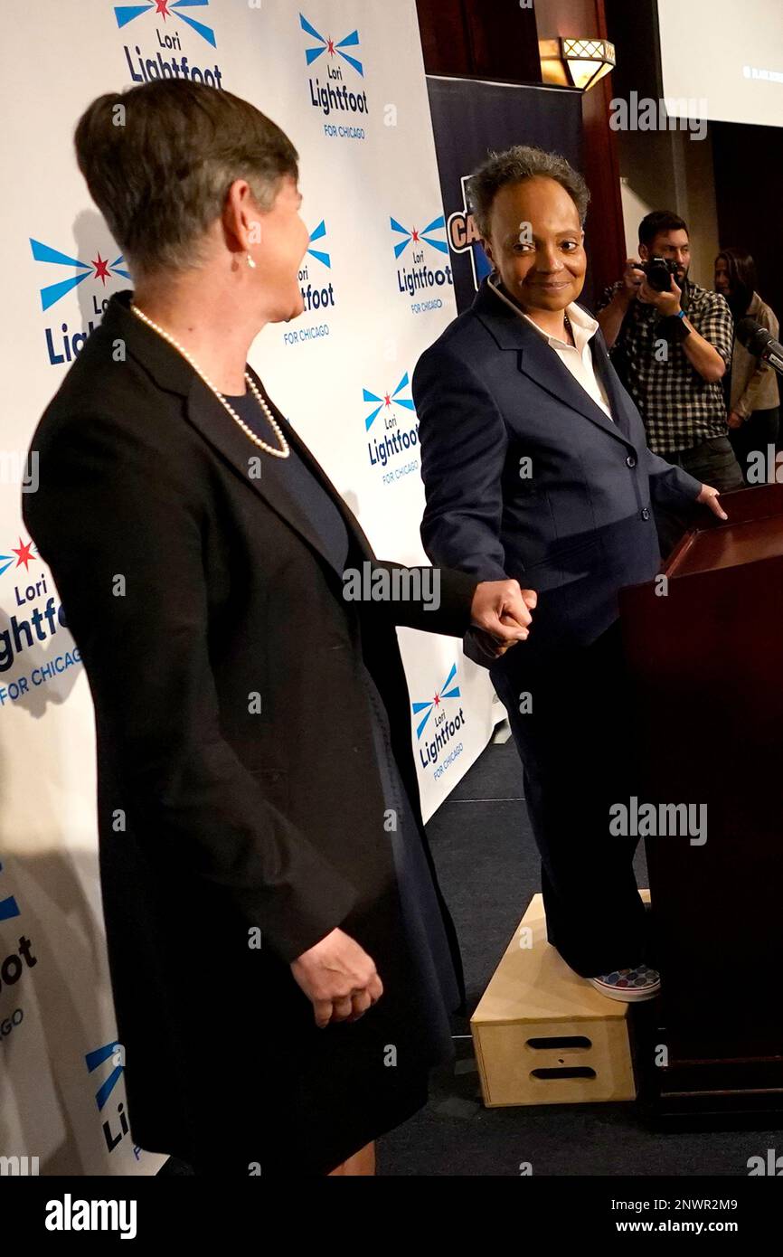 Chicago Mayor Lori Lightfoot, right, holds hands with her spouse Amy ...