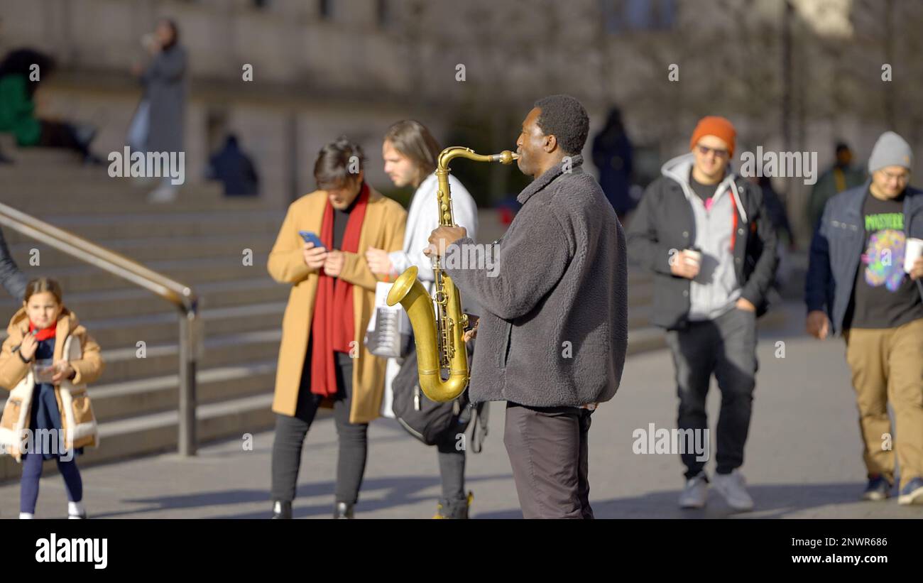 Saxophone player busking in the streets of New York NEW YORK CITY