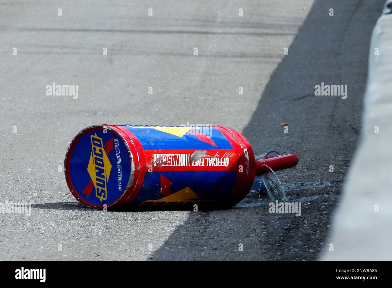 Fuel spills from the gas can of Grant Enfinger, ThorSport Racing, Ford ...