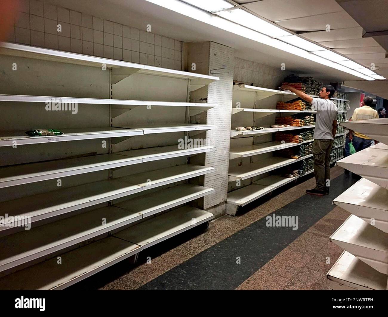 Empty shelves are seen at a national supermarket in Caracas, Venezuela