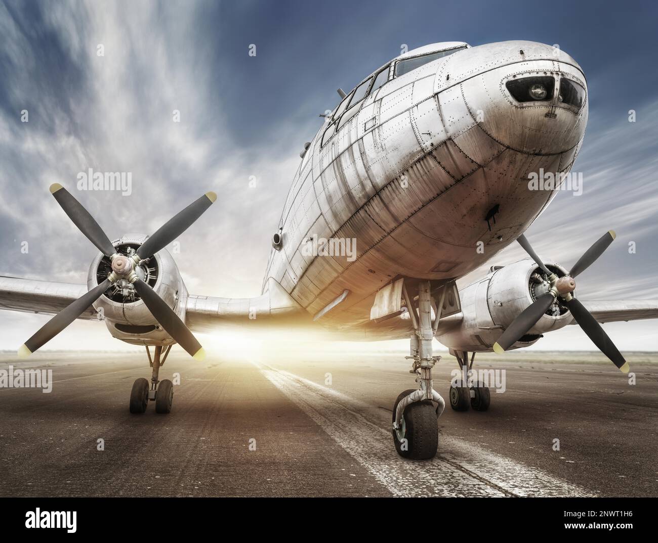 historical airplane on a runway is waiting for take off Stock Photo - Alamy