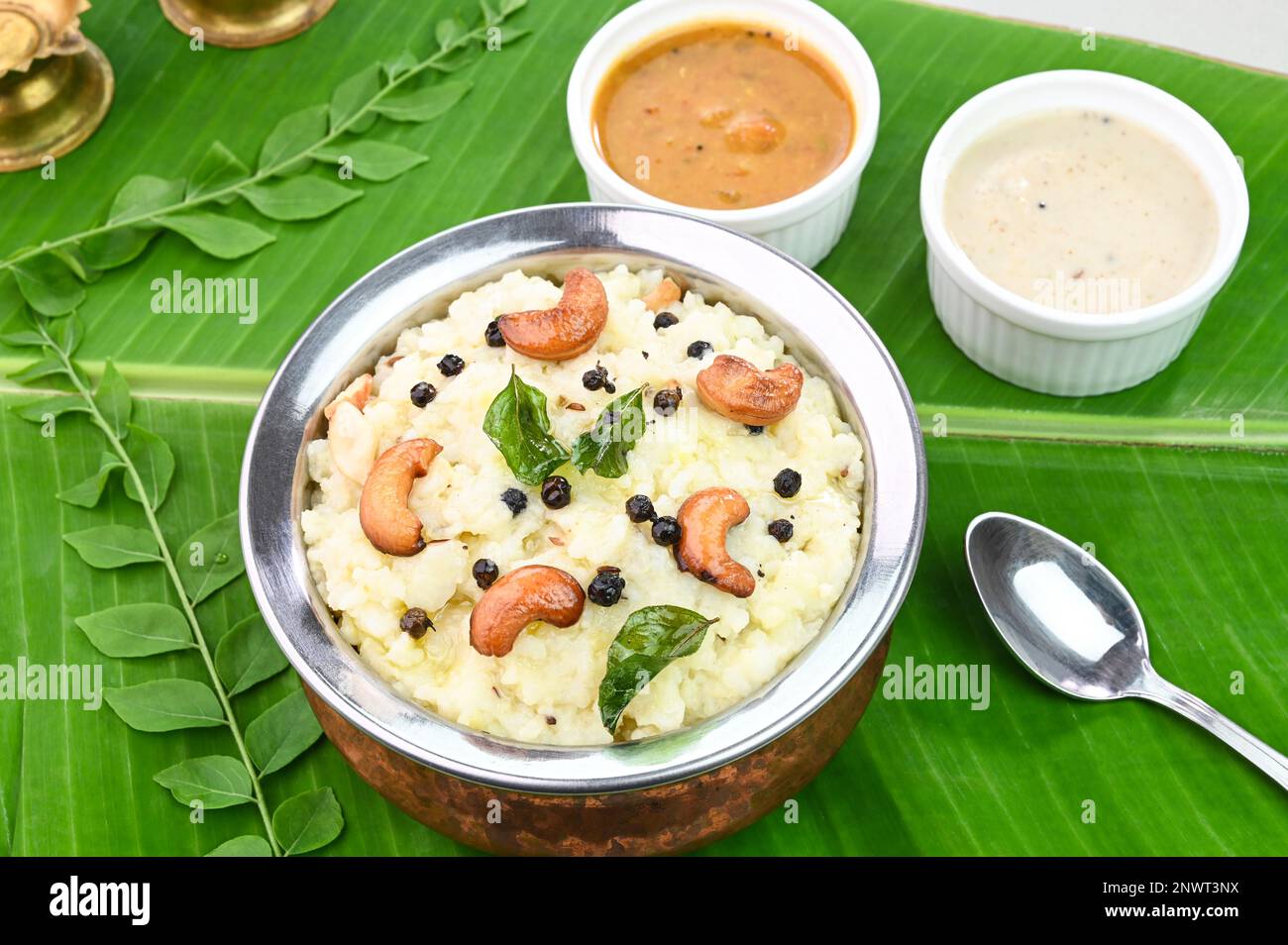 Ven Pongal famous south indian breakfast served in banana leaf Stock Photo