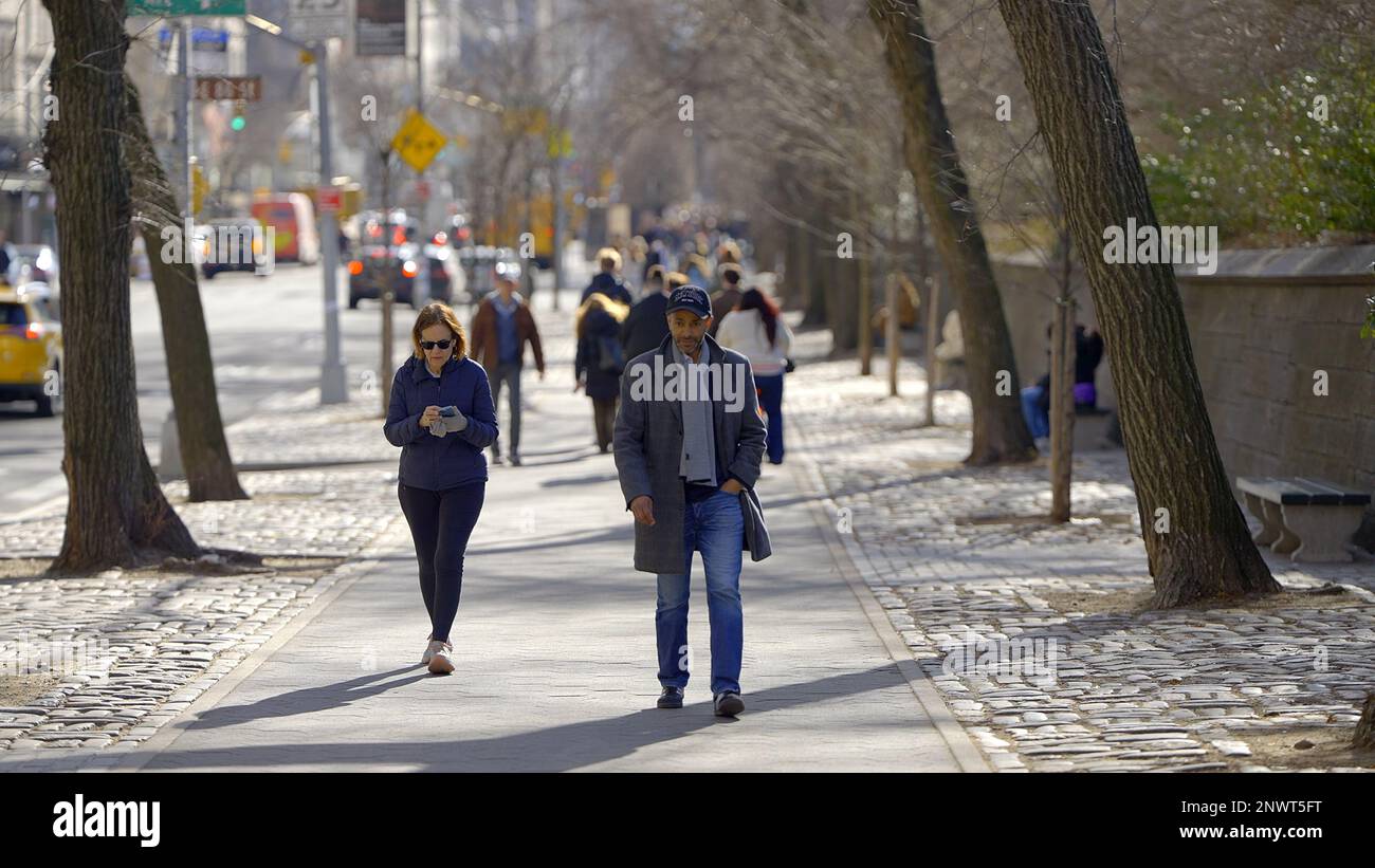 Walking on 5th Avenue Central Park East in New York - NEW YORK CITY, USA - FEBRUARY 14, 2023 Stock Photo