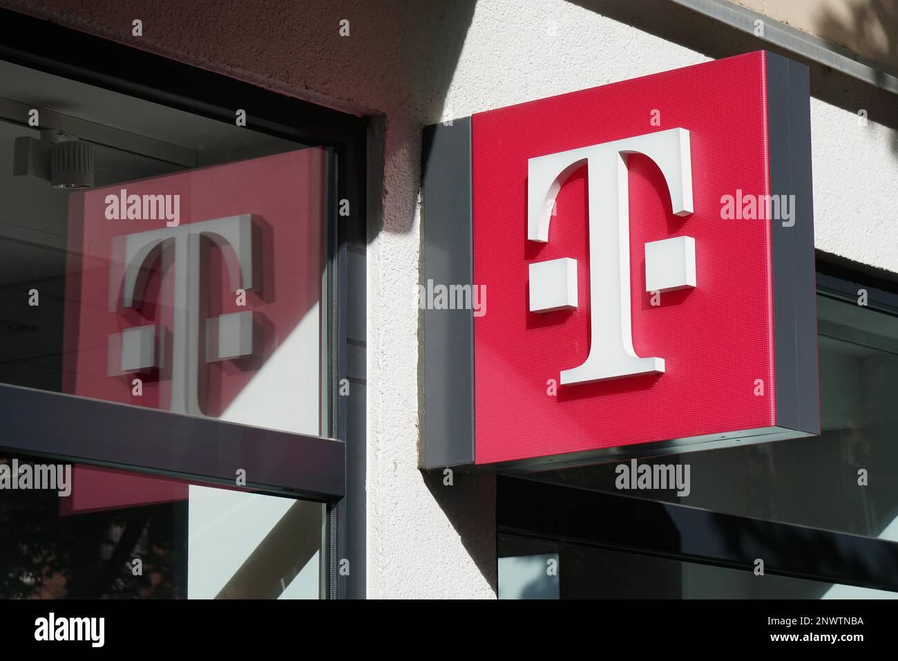 Hannover, Germany - October 8, 2017: T logo at German telecommunications company Telekom Deutschland chain store at Lister Meile Stock Photo