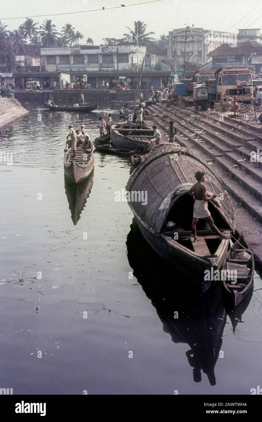 Loading and unloading of goods from cargo boats at Ernakulam market boat jetty, Kerala, South India, India, Asia Stock Photo