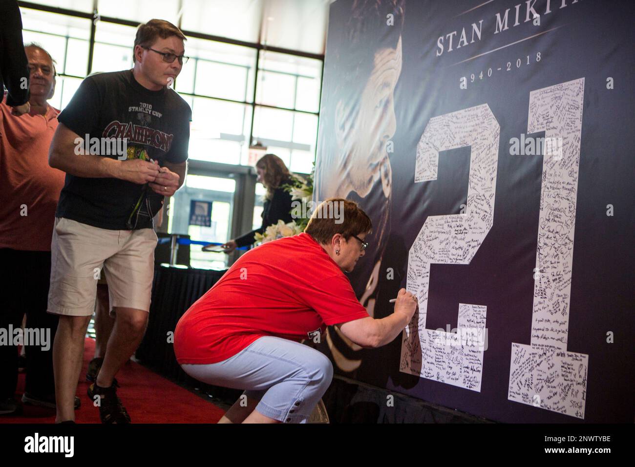 Fans sign a banner at the memorial service for Chicago Blackhawk Stan Mikita  at the United Center, Sunday, Aug. 12, 2018. Mikita, who helped lead the  Blackhawks to the 1961 Stanley Cup