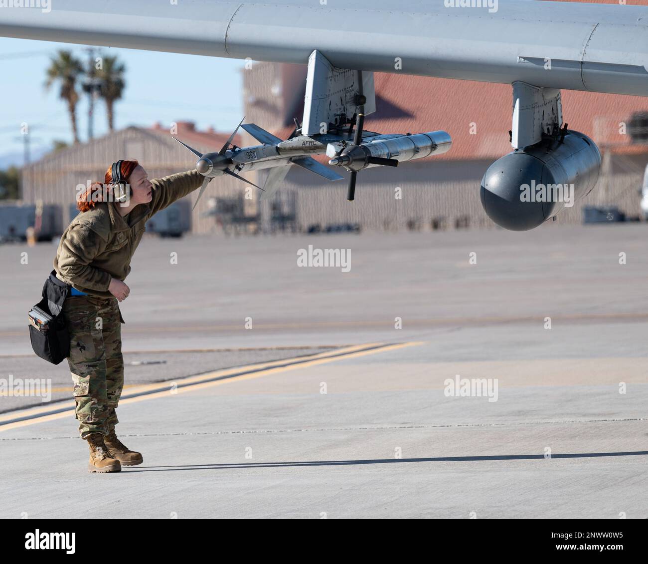 U.S. Air Force Senior Airman Sydney Woo, 354th Fighter Generation Squadron weapons specialist, inspects a missile on an A-10C Thunderbolt II during Red Flag 23-1 at Nellis Air Force Base, Nevada, Jan. 24, 2023. Red Flag provides unique training with an emphasis on Airmen and Guardians’ readiness for high-end warfighting and strategic competition. Stock Photo