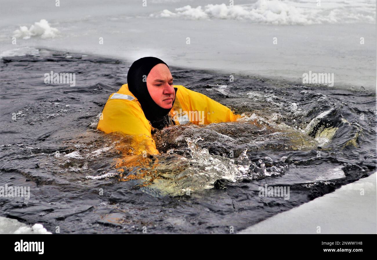 A firefighter wearing a cold-water immersion protective suit acts as a ...