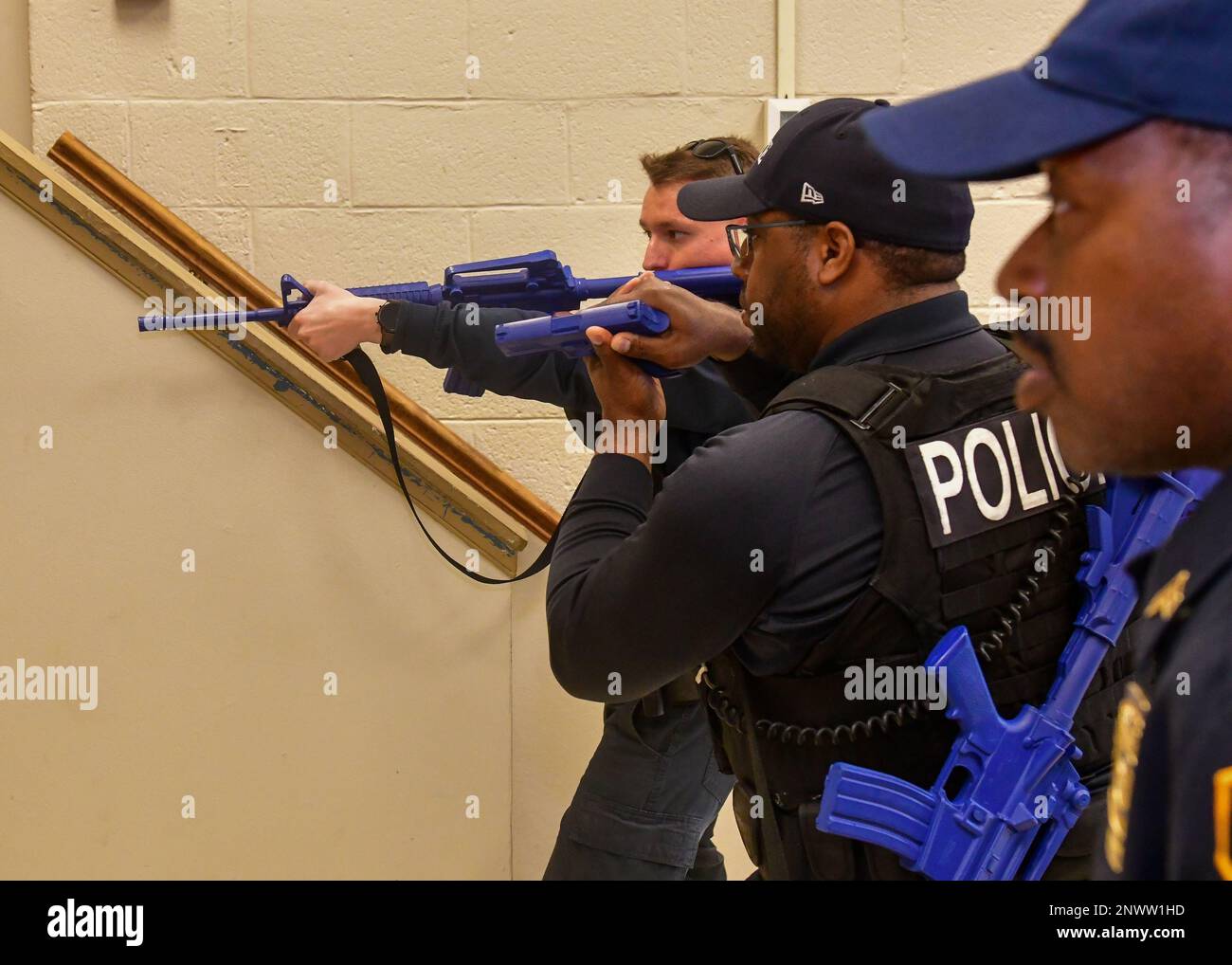 DAHLGREN, VA Naval District Washington police officers survey a room