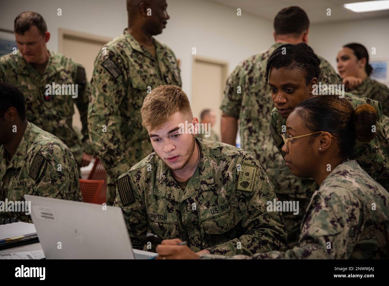 230201-N-GF955-1019  NAVAL AIR STATION JACKSONVILLE, Fla. (Feb. 1, 2023) Airman Caleb Ripton, assigned to Helicopter Maritime Strike Squadron (HSM) 72, looks at open ratings during a Professional Apprenticeship Career Track team visit at Naval Air Station Jacksonville, Florida, Feb. 1, 2023. The Fleet Engagement Team met with PACT Sailors during their PACT engagement to provide career counseling, designate ratings and negotiate orders on site. Stock Photo