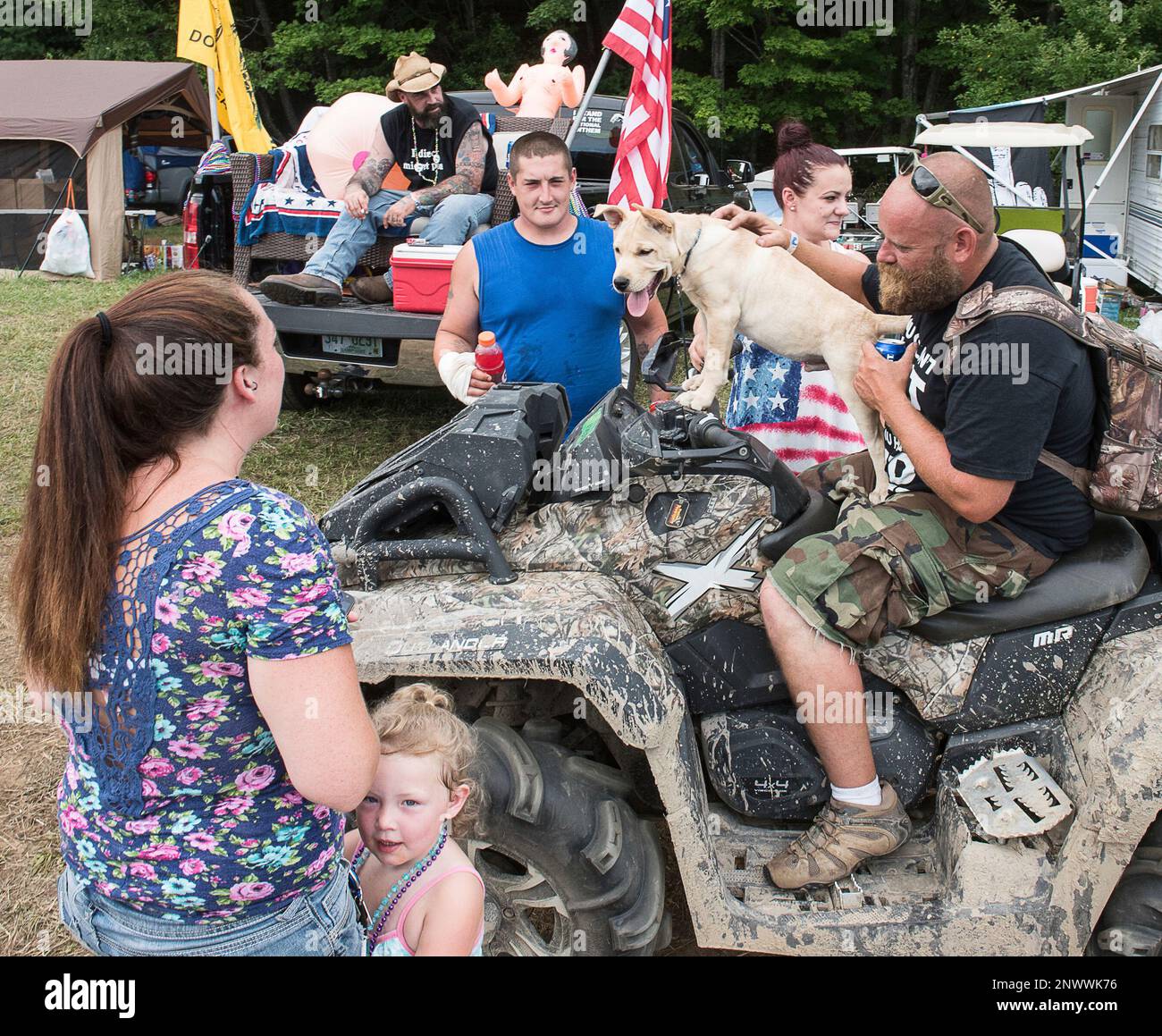 Jake Strait, of Gardner, Mass., gives his friends dog Beast a ride on his  ATV at 2018 Redneck Games in Hebron, Maine Friday afternoon August 3, 2018.  The gathering is expected to