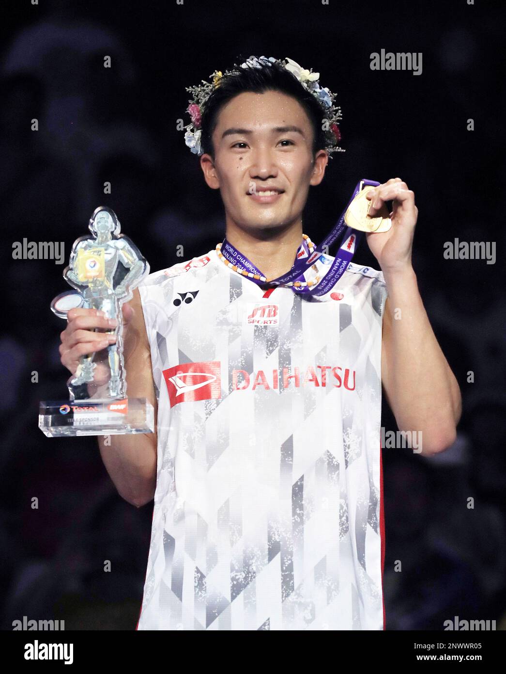Japan s Kento Momota hits a shuttle during the Total BWF World Championships 2018 men s singles final match against China s Shi Yuqi at Nanjing Qing ao Sports Park in Nanjing Jiangsu Sheng China on