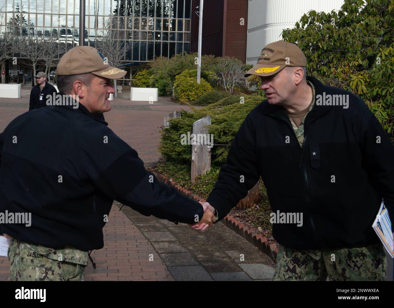 230215-N-ED185-1006  NAVAL BASE KITSAP – BANGOR, Wash. (Feb. 15, 2023) Rear Admiral Mark Behning, commander, Submarine Group 9, right, greets Rear Adm. Jeff Jablon, commander, Submarine Force, U.S. Pacific Fleet, during Jablon’s visit to Naval Base Kitsap - Bangor, Feb. 15, 2023. The Pacific Submarine Force provides strategic deterrence, anti-submarine warfare; anti-surface warfare; precision land strike; intelligence, surveillance, reconnaissance and early warning; and special warfare capabilities around the globe. Stock Photo