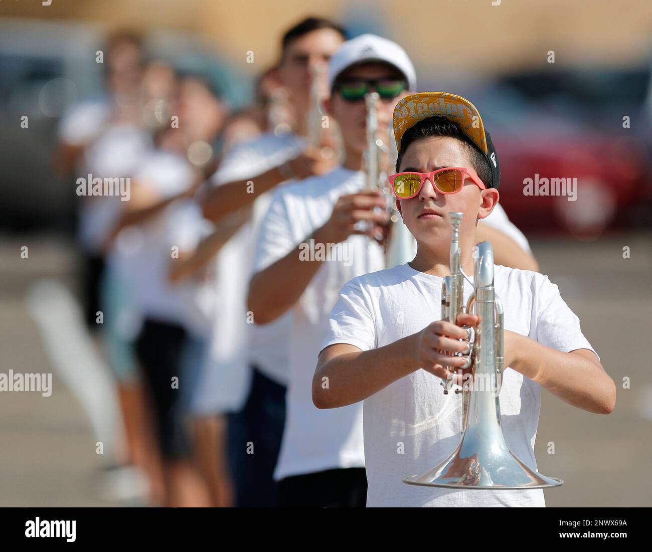 Permian High School freshman Damian Marquez holds his mellophone at the "carry position" on