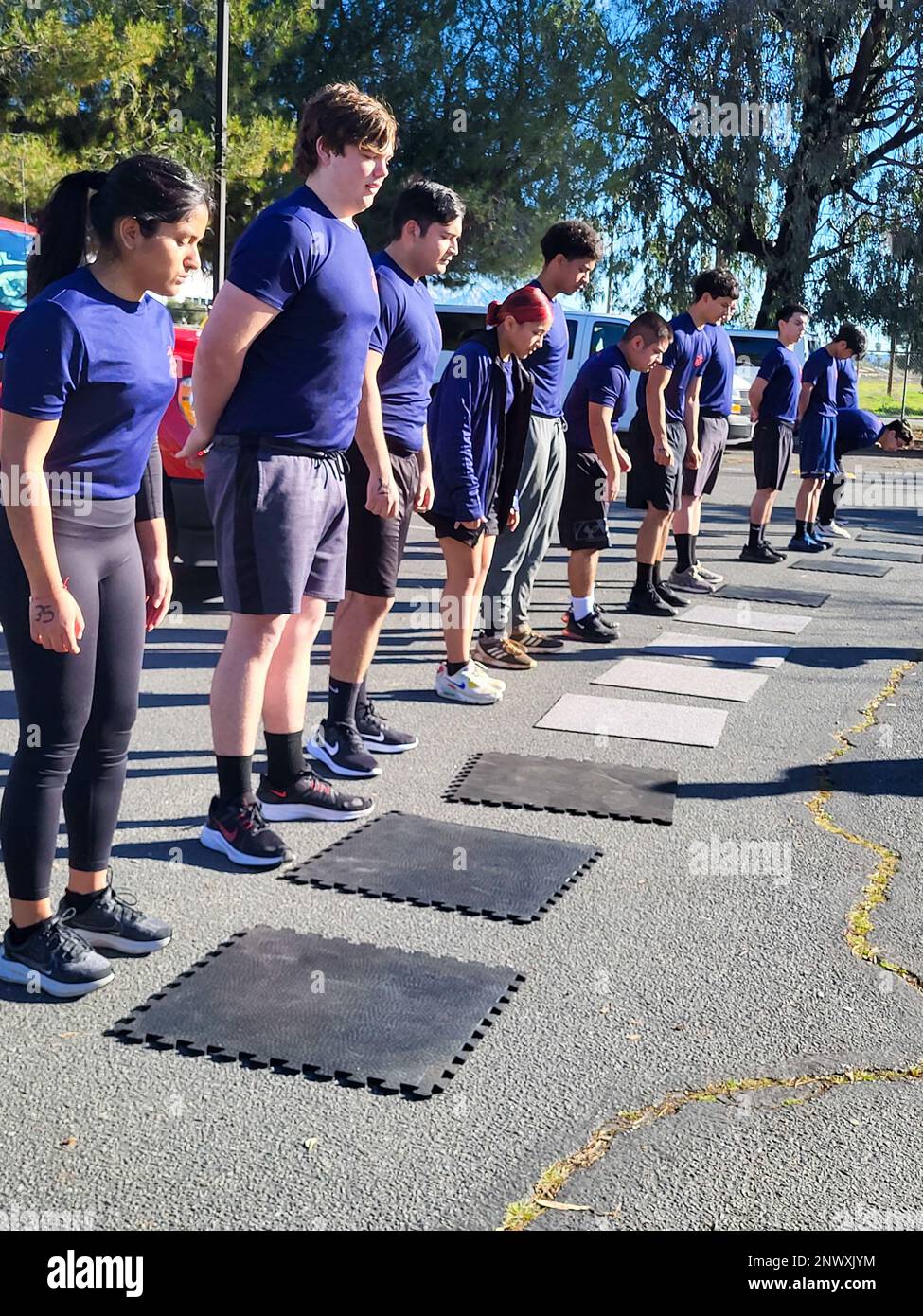 Future Marines in the delayed entry program with Recruiting Station Riverside, 12th Marine Corps District, participate in an initial strength test (IST) at the Recruiting Station Riverside Headquarters on March Air Reserve Base, California on Jan. 23, 2023. The IST is a shortened version of the physical fitness test (PFT) conducted to gauge the physical readiness of future Marines. Stock Photo