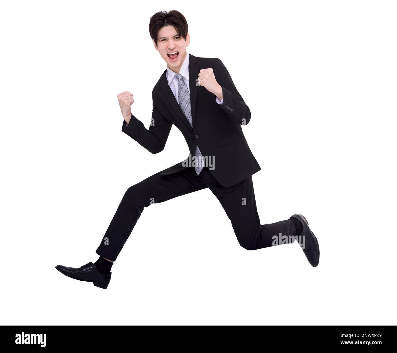 Excited business man running and jumping in the air with success