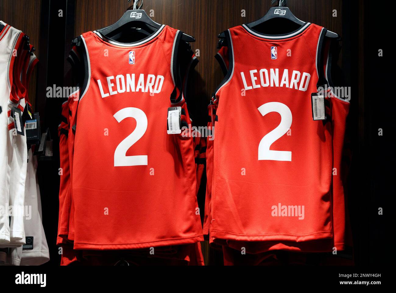 A man makes NBA jerseys for newly-acquired Toronto Raptors player