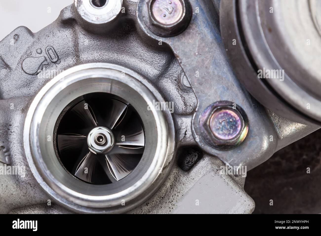 Turbo charger installed for power booster torque drive on white isolated background. Auto service industry for racing. Stock Photo