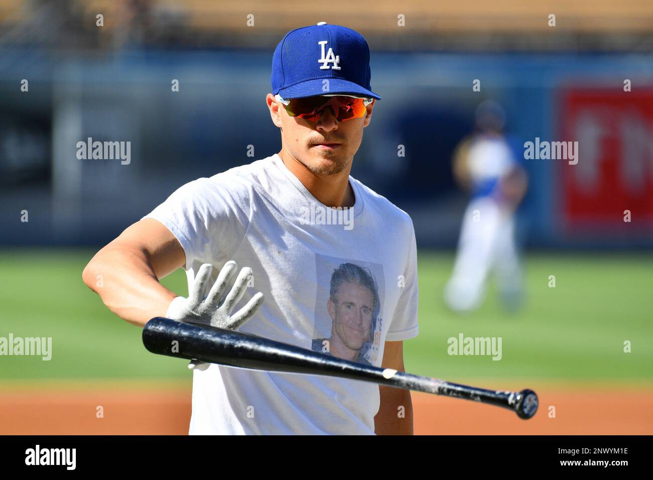 LOS ANGELES, CA - JULY 13: Los Angeles Dodgers outfielder Enrique Hernandez  (14) wears a t-shirt with Los Angeles Dodgers infielder Chase Utley's face  on it during batting practice before a MLB