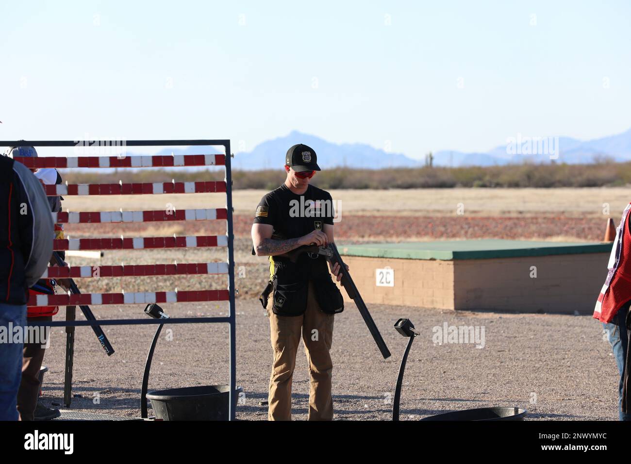 Spc. Grayson Davey, USAMU Shotgun Team Trap shooter, inspects his shotgun during the USA