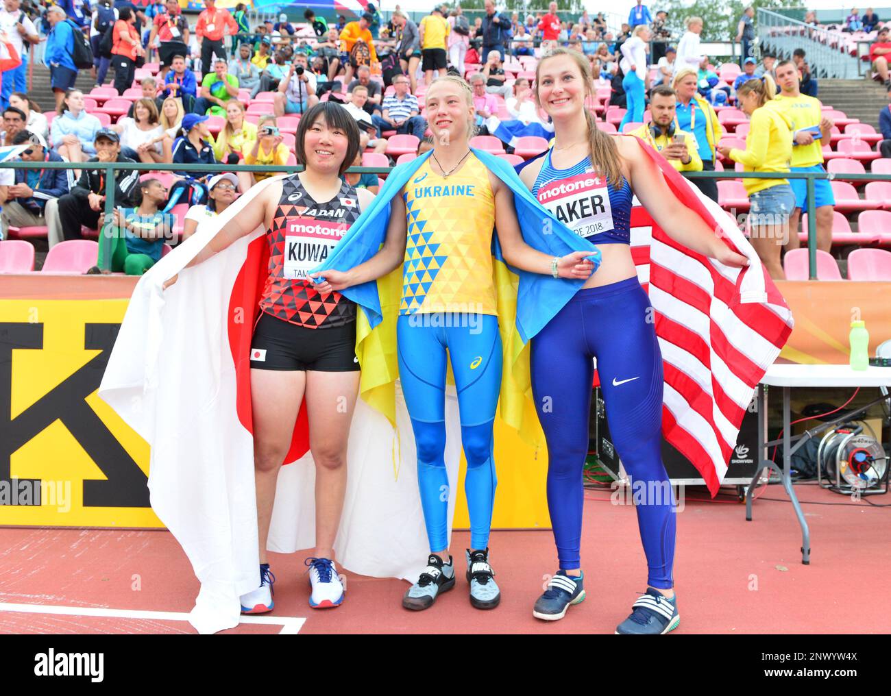 Women's javelin gold medalist Alina Shukh (UKR), center, poses with silver medalist Tomoka