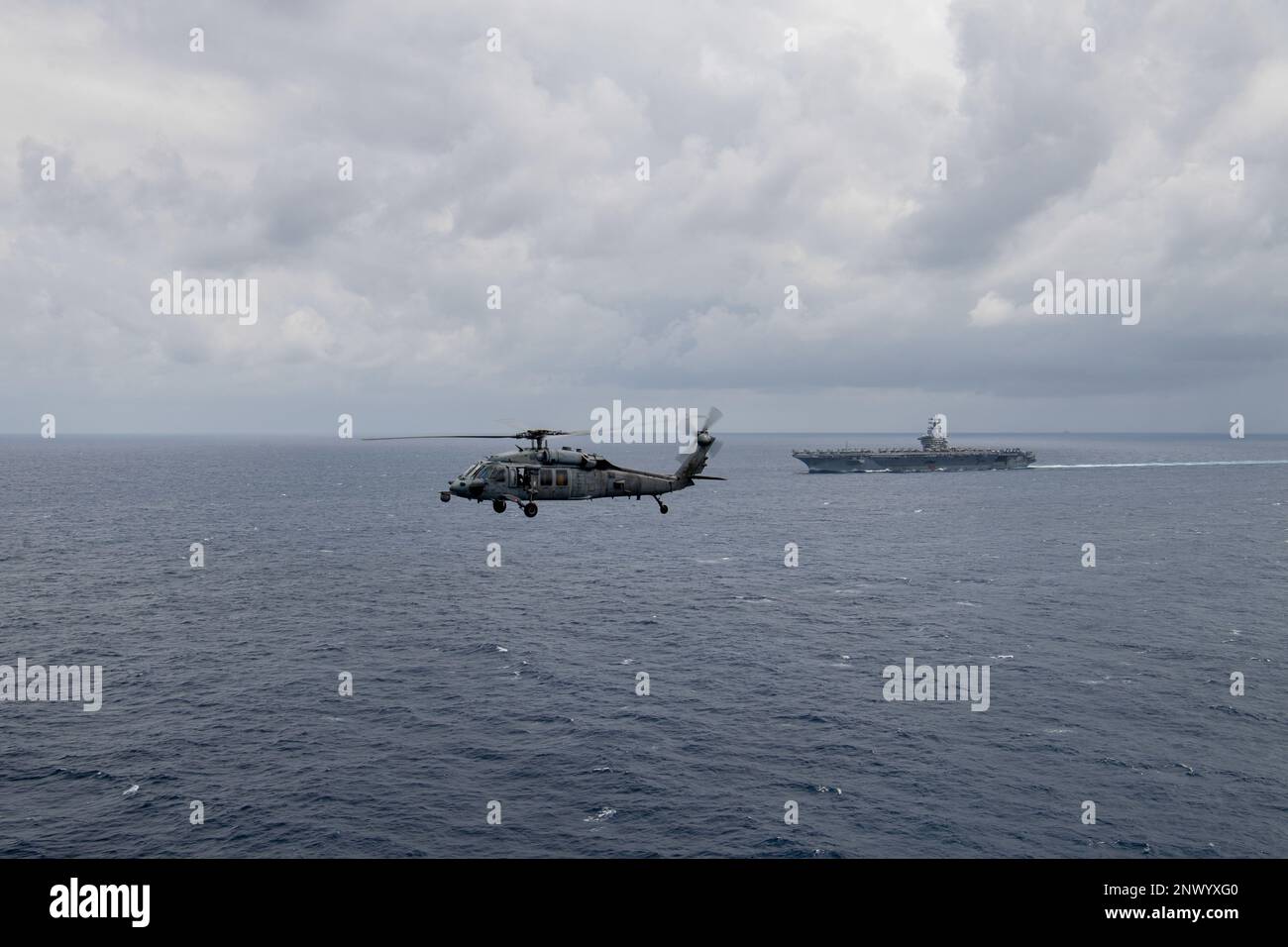 230215-N-ZQ263-1354 SOUTH CHINA SEA (Feb. 15, 2023) An MH-60S Sea Hawk