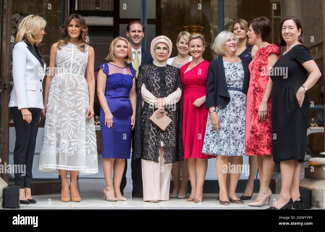 From left, French First lady Brigitte Macron, US First Lady Melania Trump,  Malgorzata Tusk, Husband of Luxembourg's pime minister Gauthier Destenay, First  Lady of Turkey Emine Gulbaran Erdogan, Partner of Estonia's Prime