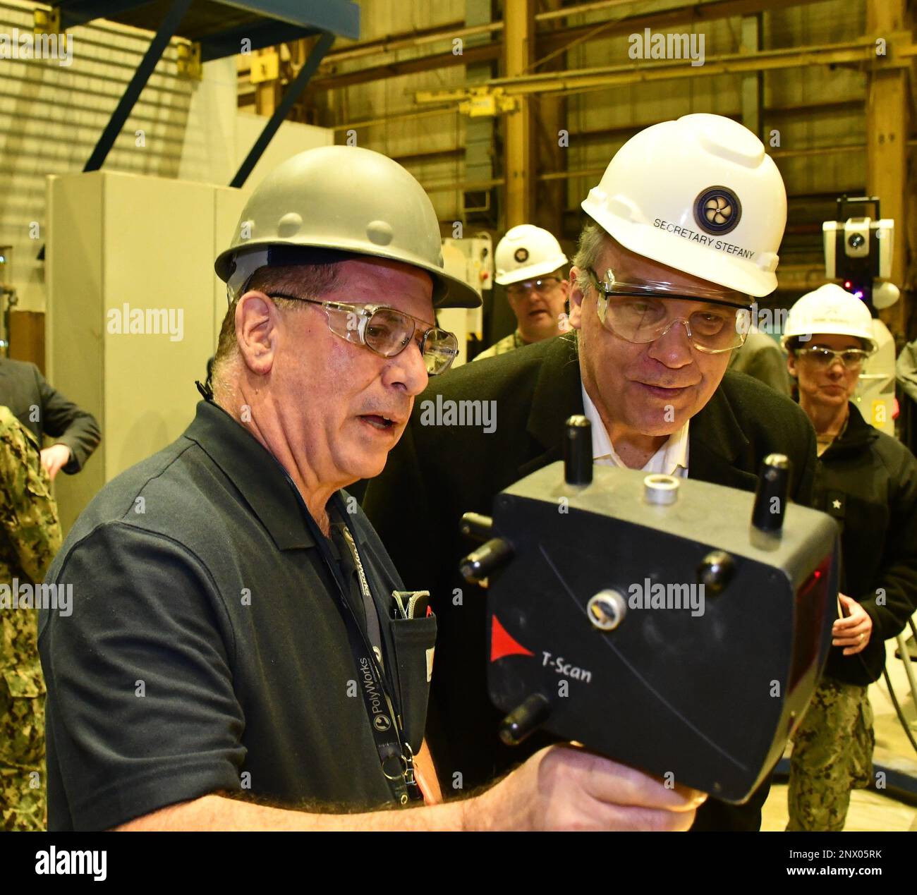 Engineering Tech Joe Santola (left) demonstrates to Assistant Secretary ...