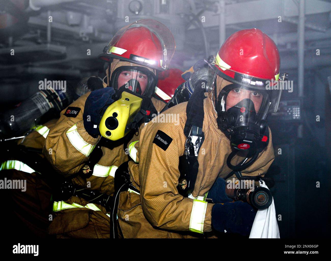 Boatswain’s Mate Seaman Brendan Bailey, left, and Seaman Isaiah Crespo