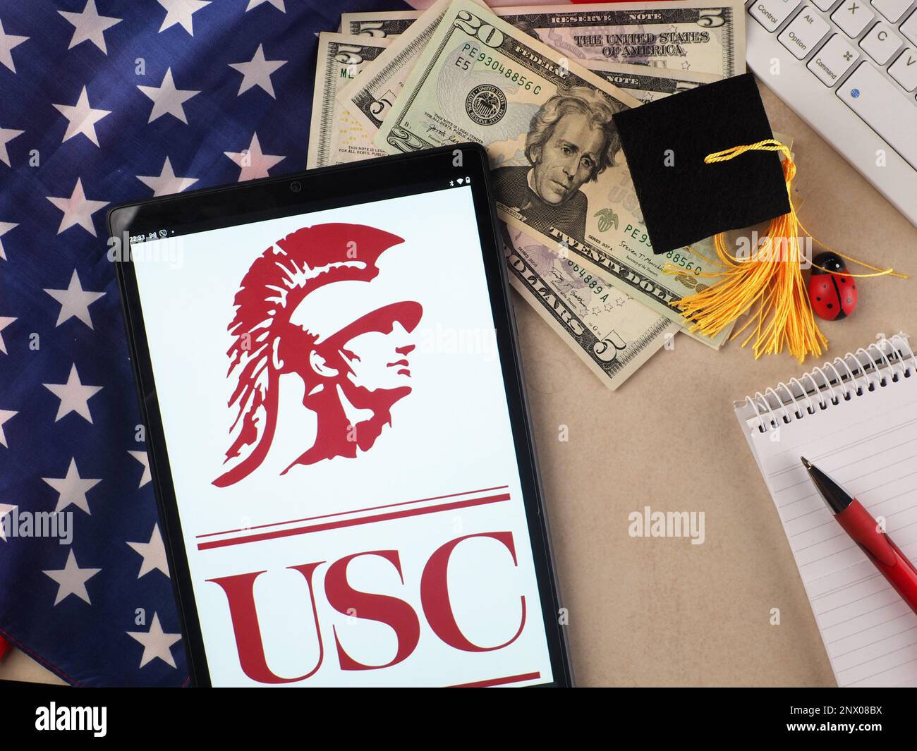 In this photo illustration, University of Southern California  logo seen displayed on a tablet. Stock Photo