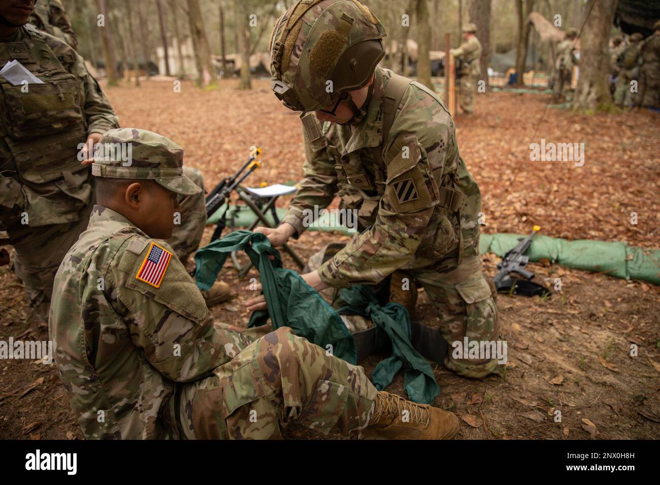 Soldiers from the 3rd Infantry Division learn to make a splint in order