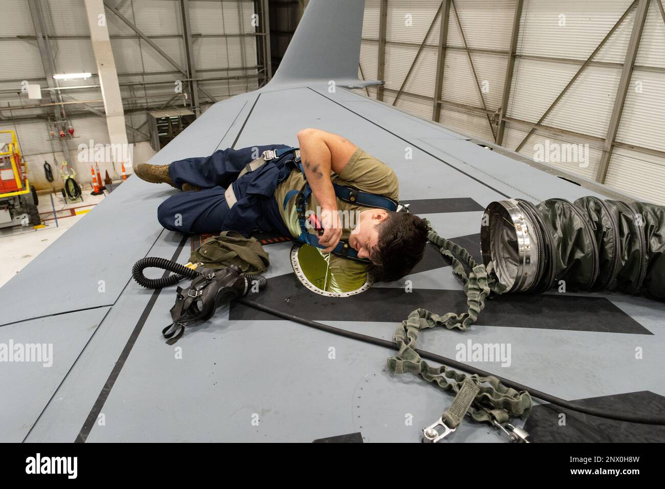 Senior Airman Ronald Garcia, 436th Maintenance Squadron fuel systems journeyman, removes a faulty number four main fuel tank low level float switch on a C-17 Globemaster III at Dover Air Force Base, Delaware, Jan. 10, 2023. Fuel systems technicians removed and replaced the faulty switch and a main tank probe bracket while the aircraft was inside the 436th/512th MXS aircraft fuel systems repair facility. Stock Photo