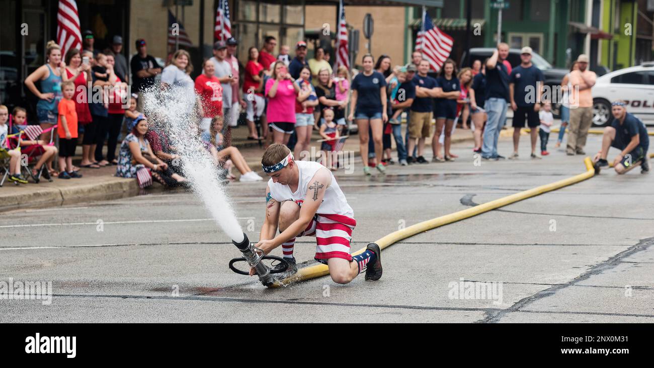Gallatin's Josh Hill, right, makes the final fire hose connection