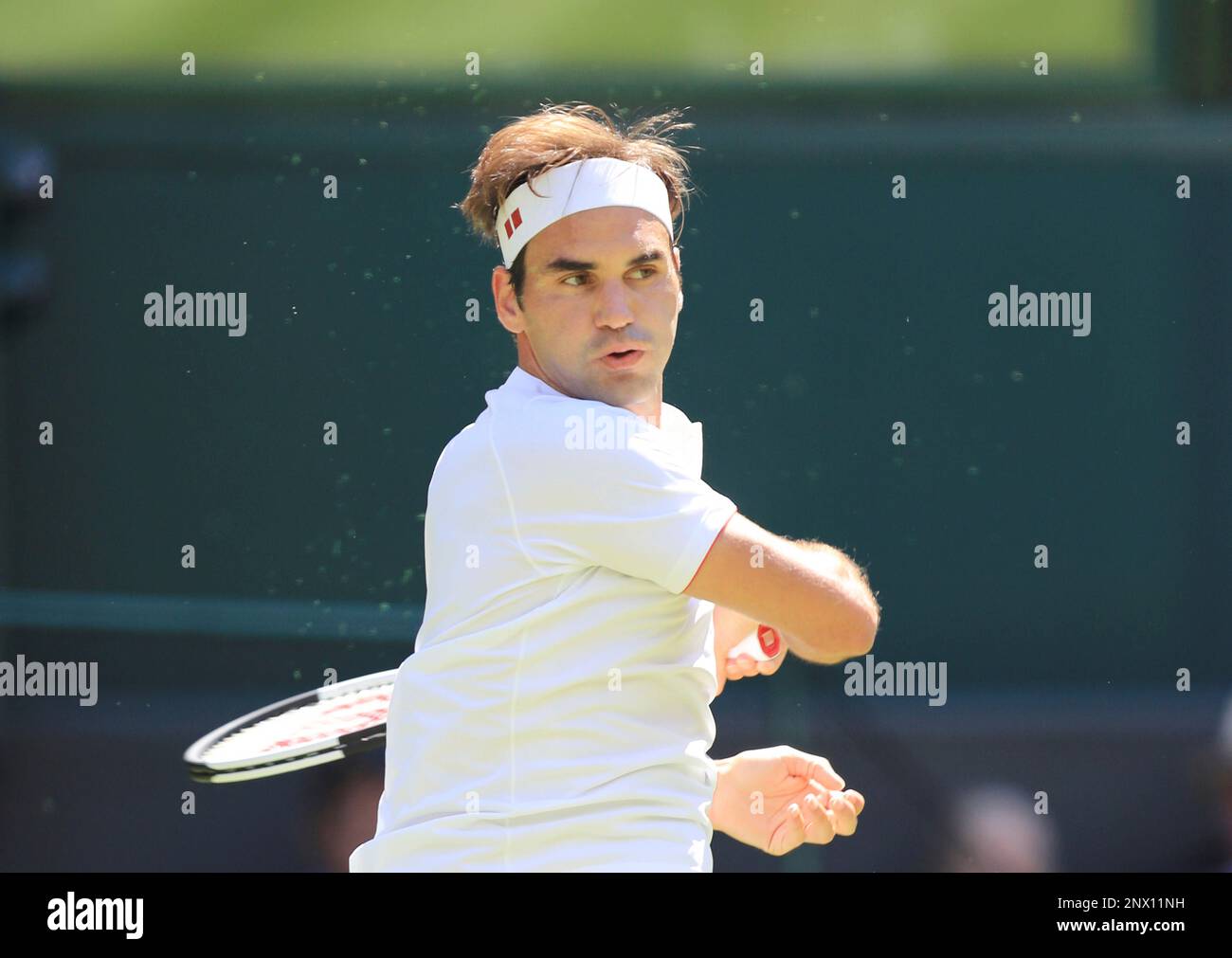 Roger Federer of Switzerland hits a ball during the gentlemens singles first round of the Wimbledon tennis tournament against Dusan Lajovic of Serbia at All England Tennis Club in London on July