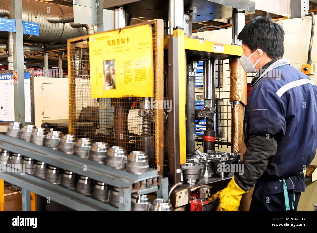 QINGDAO, CHINA FEBRUARY 1, 2023 An employee processes auto parts at