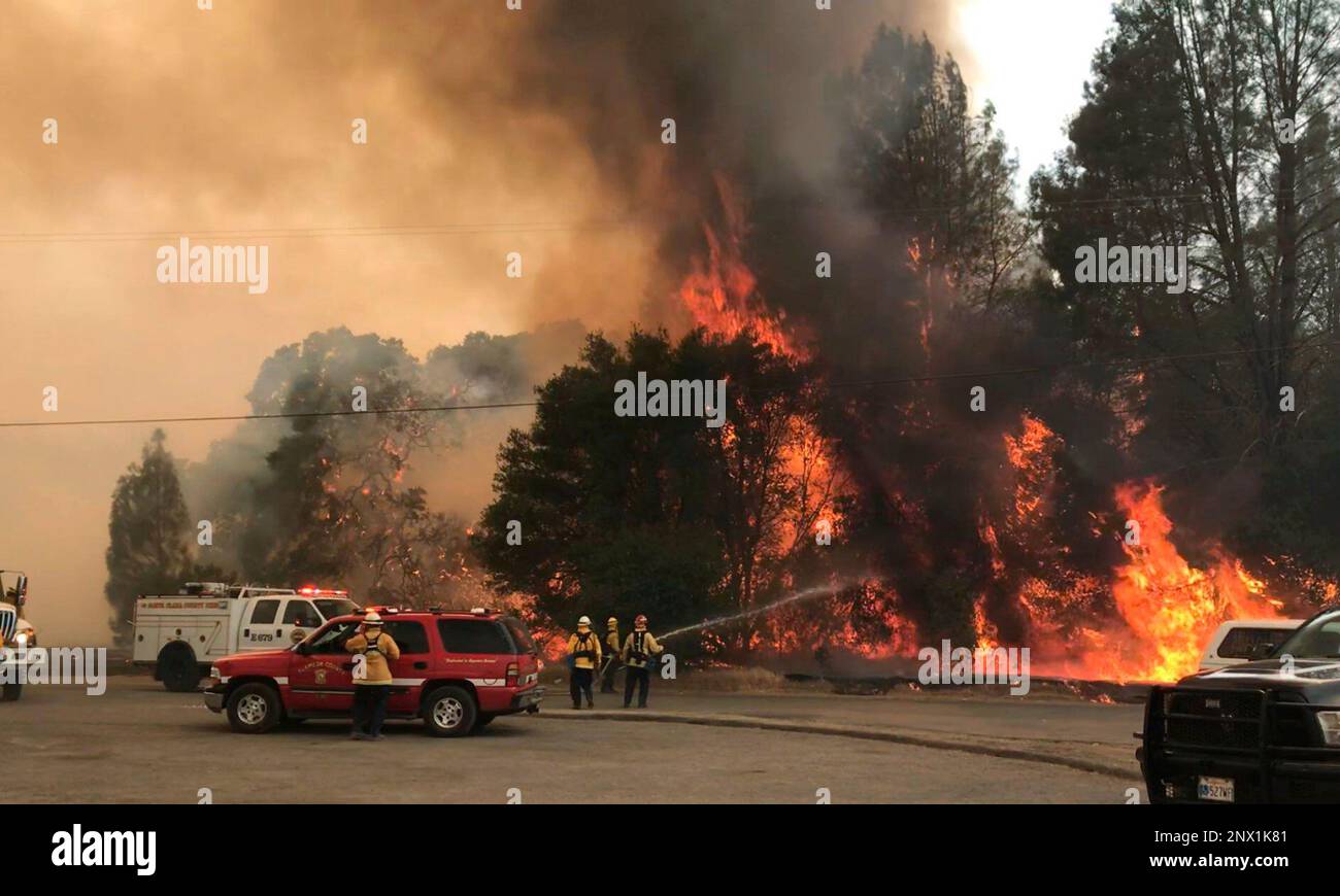 In this photo provided by the Cal Fire Communications, firefighters