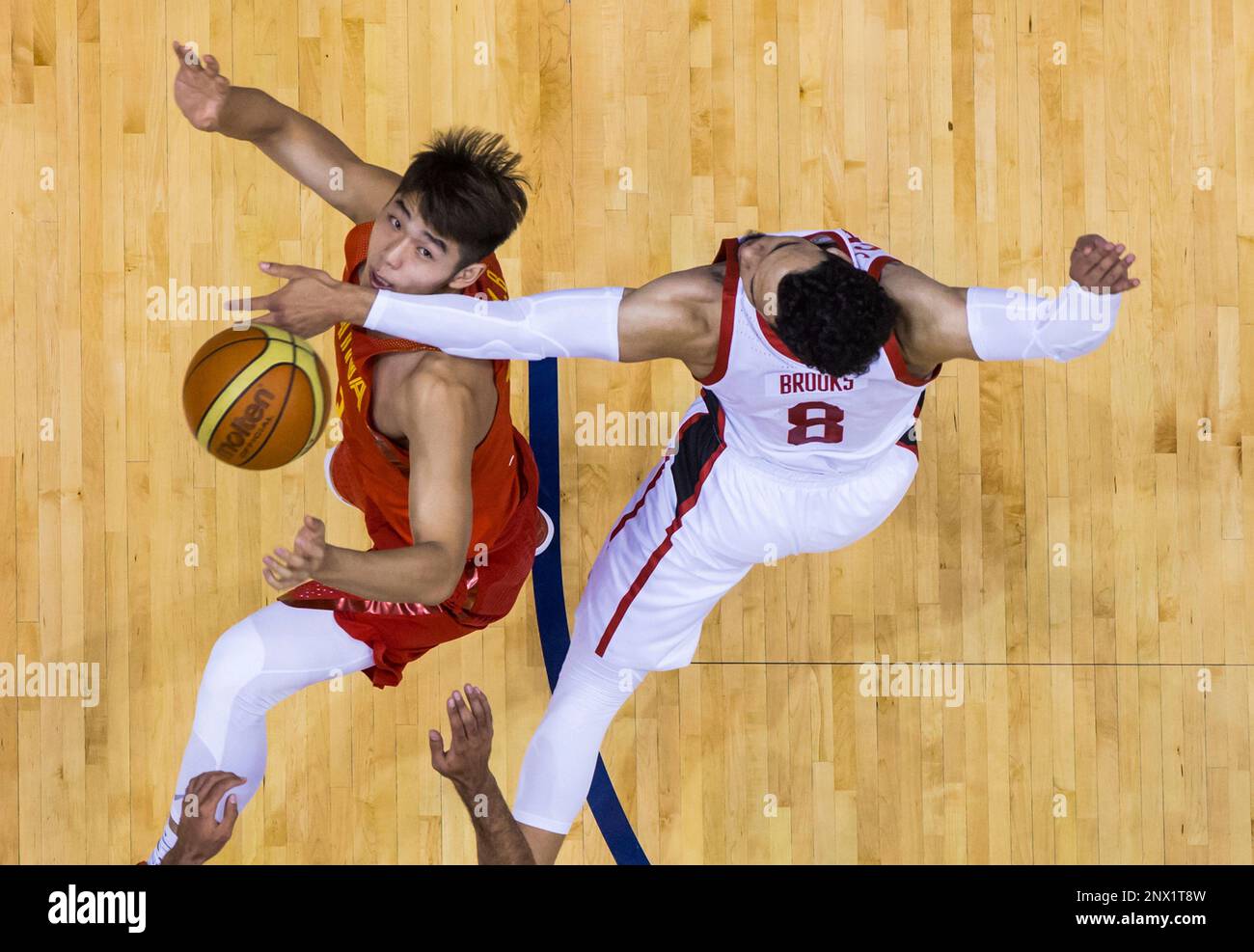 China's Wenbo Lu, left, and Canada's Dillon Brooks vie for a rebound during  first half Pacific Rim Basketball Classic action in Vancouver on Friday  June 22, 2018. (Darryl Dyck/The Canadian Press via