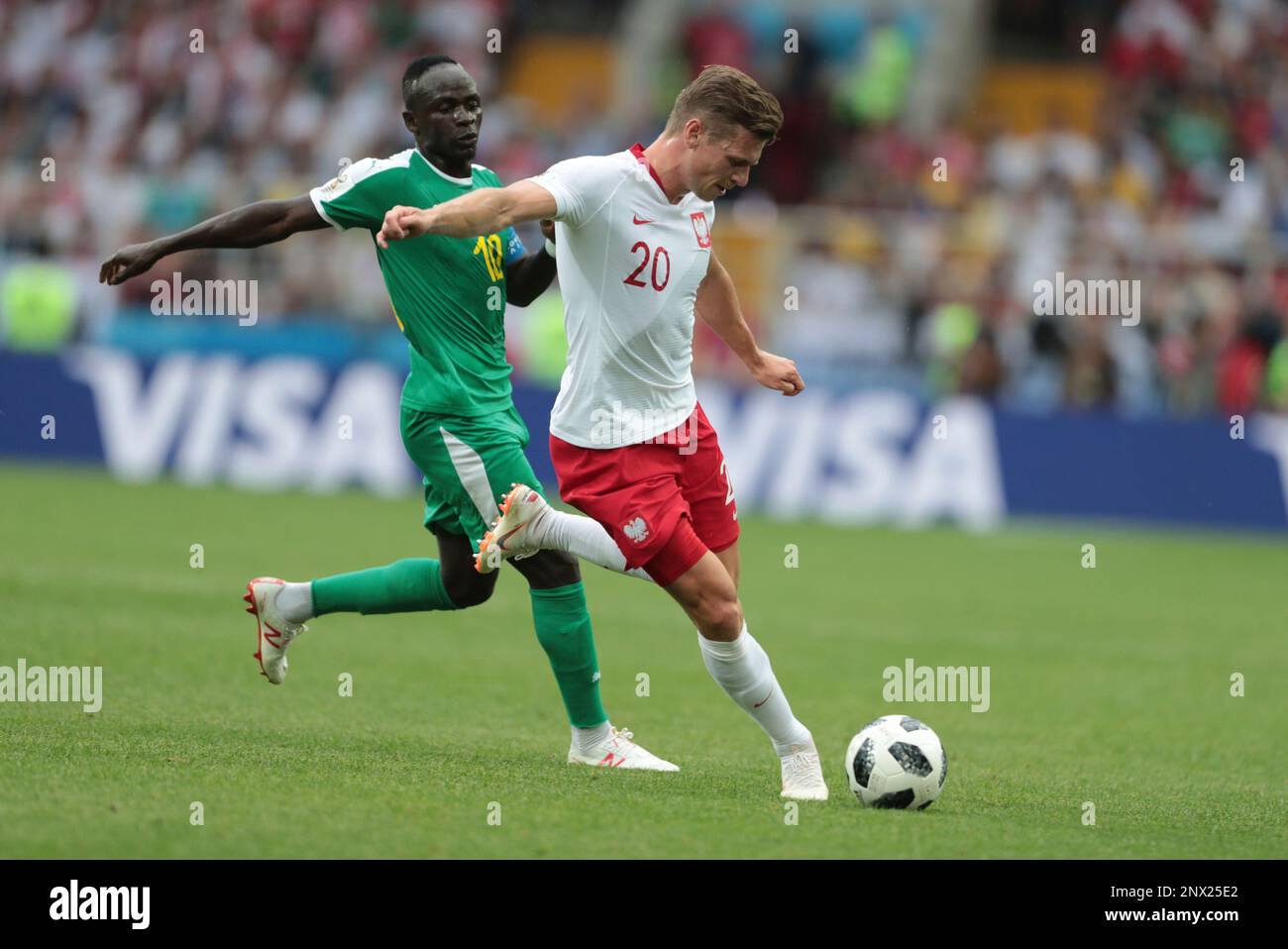 MOSCOW, RUSSIA - JUNE 19: forward Sadio Mane of Senegal and defender Lukasz  Piszczek of Poland during a Group H 2018 FIFA World Cup match between  Poland and Senegal on June 19,