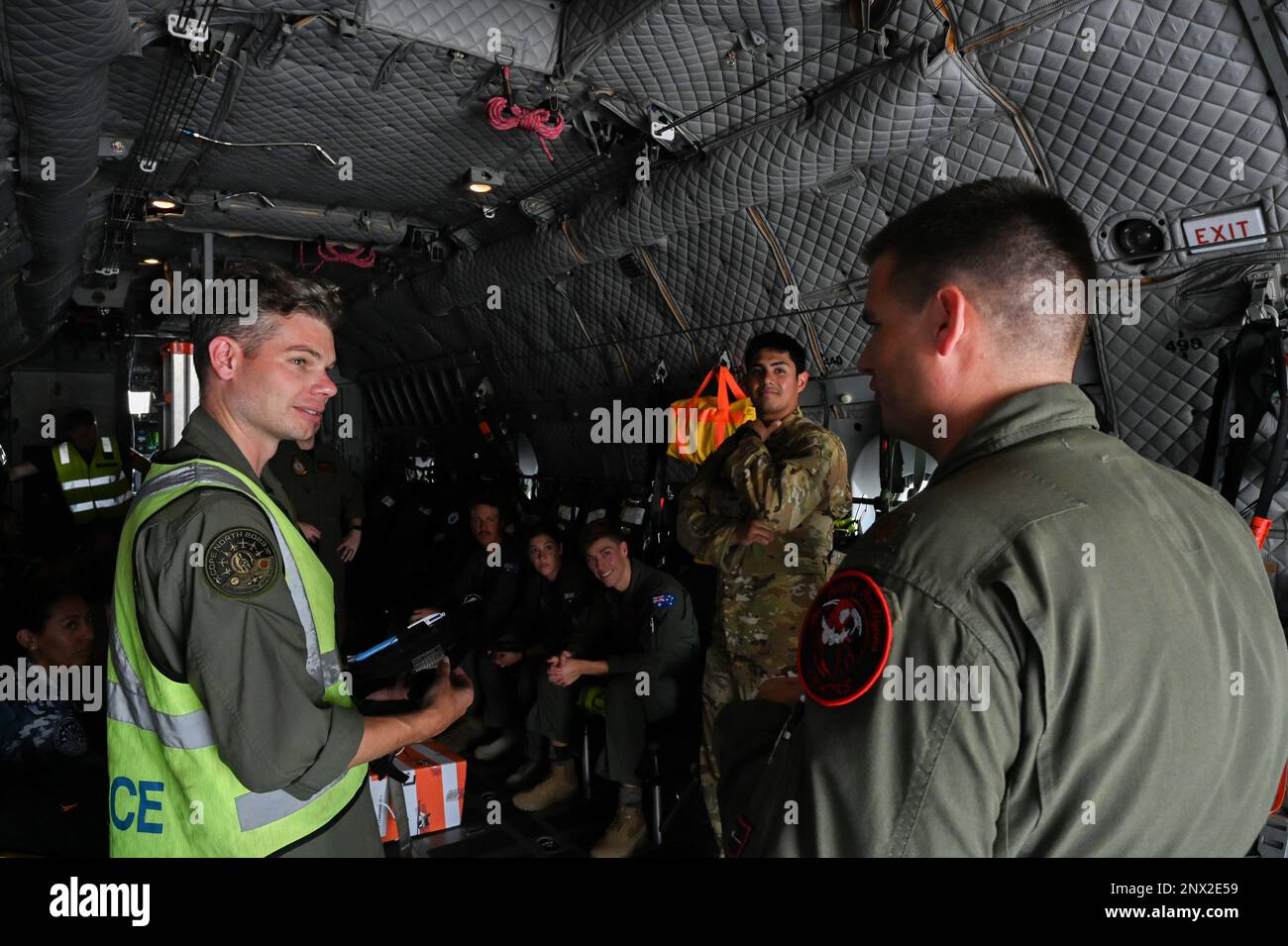 Royal Australian Air Force C-27J Spartan Aircraft Flight Lieutenant Ben Calaman briefs a Search and Rescue mission with a U.S. Air Force member 119th Operations Group on board C-27 prior to conducting a joint Search and Rescue mission supporting the U.S. Coast Guard that took place near Andersen Air Force Base, Guam on February 12 2023. These assets were able to support search and rescue operations due to being involved in Cope North, which is a combined forces exercise that focuses on building partnerships between the RAAF, U.S. Air Force, and Japan Air Self Defense Forces to enable a safe an Stock Photo