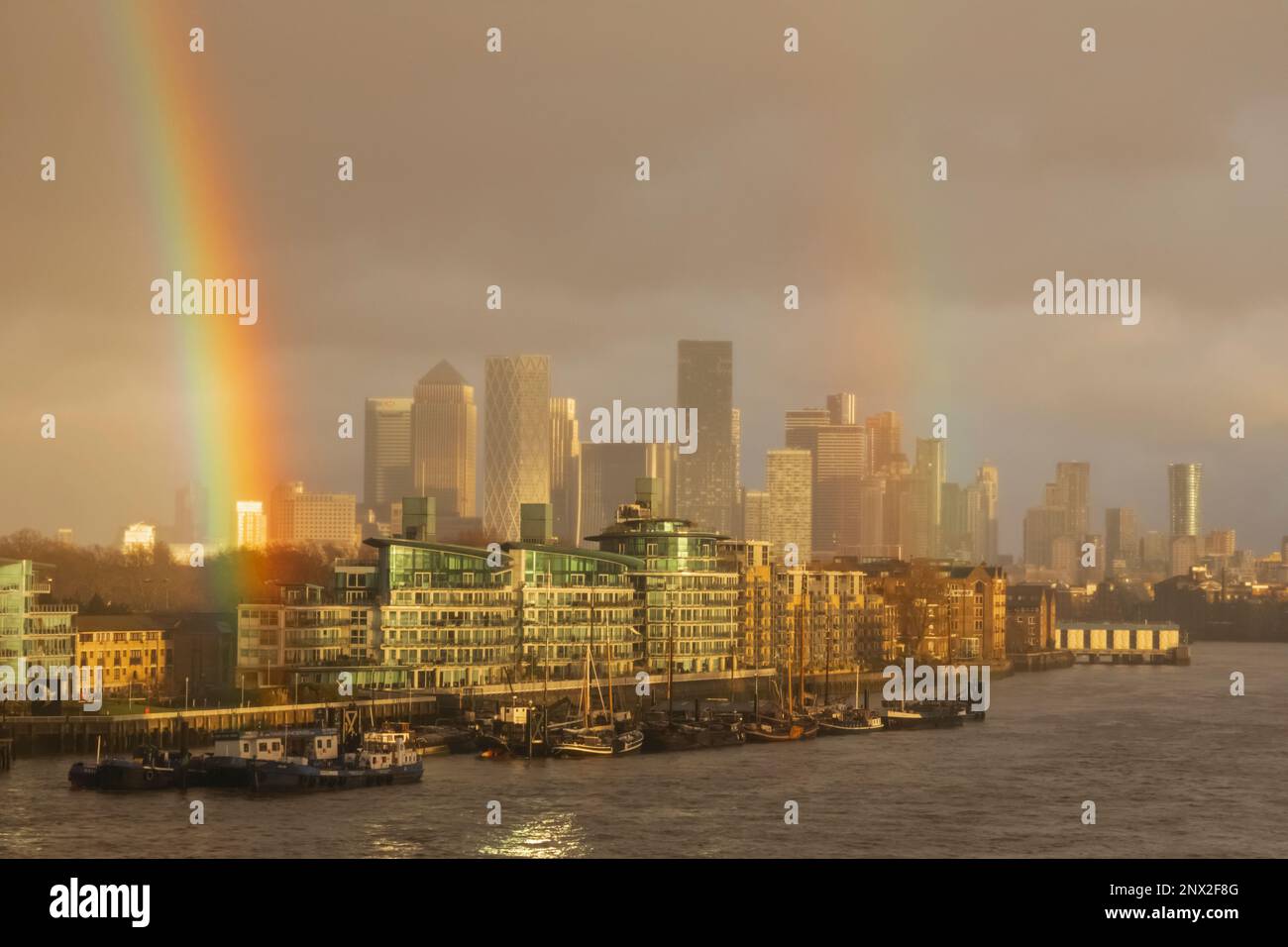 England, London, Docklands, Canary Wharf Skyline and Rainbow Stock Photo