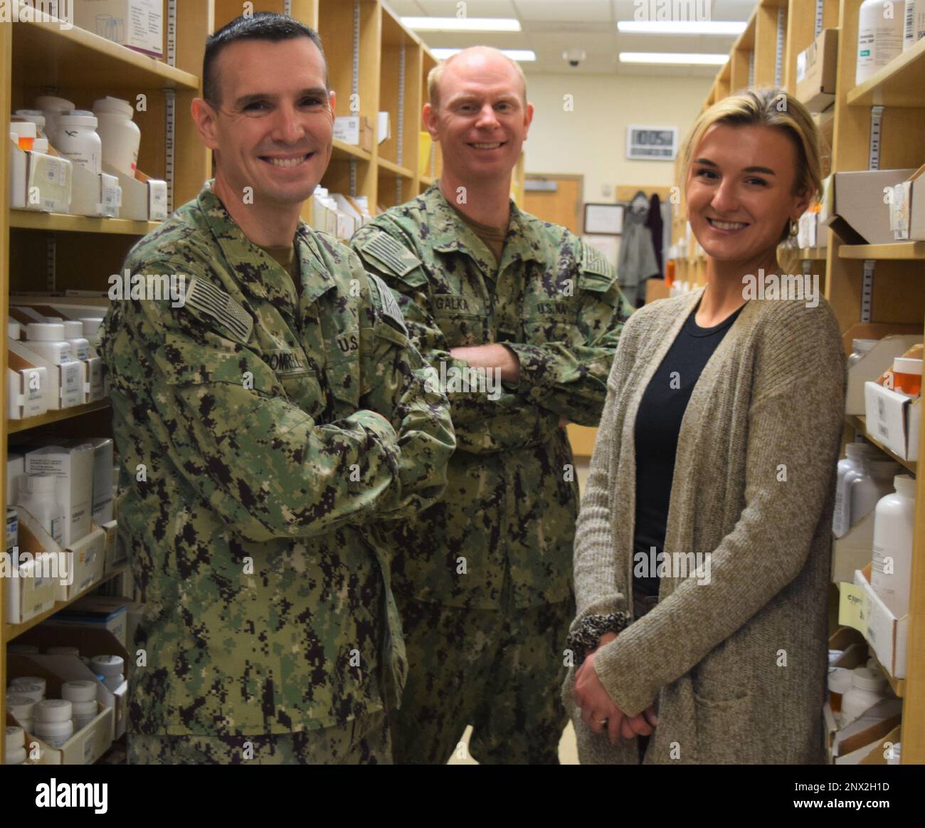 They’re behind the scenes, but not behind the times.    National Pharmacist Day, January 12, 2023, provides an annual date to recognize that the pharmacists assigned to Naval Hospital Bremerton are at the forefront in combining high tech convenience with patient-centered care.    Those days of an apothecary using an abacus to prepare and dispense medicine are long gone. NHB pharmacists - such as Lt. Cmdr. Evan Romrell, Lt. Cmdr. Jason Galka, and Isabella “Bella” Wolak – are a crucial link in providing health care support to those in need.    They are intricately involved in offering advice abo Stock Photo