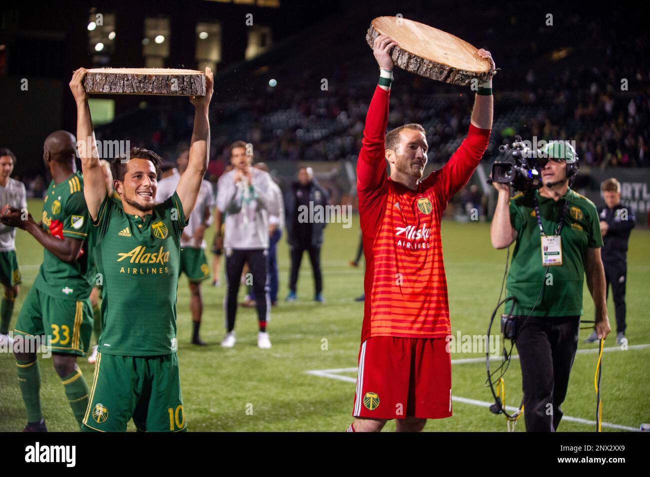 PORTLAND, OR - JUNE 15: Portland Timber players Sebastián Blanco (left) and Jeff Attinella (right) lift their trophies for their goal and clean sheet at the end of the Portland Timbers game versus the LA Galaxy in a United States Open Cup match on June 15, 2018, at Providence Park, OR. (Photo by Diego G Diaz/Icon Sportswire) (Icon Sportswire via AP Images) Stock Photo