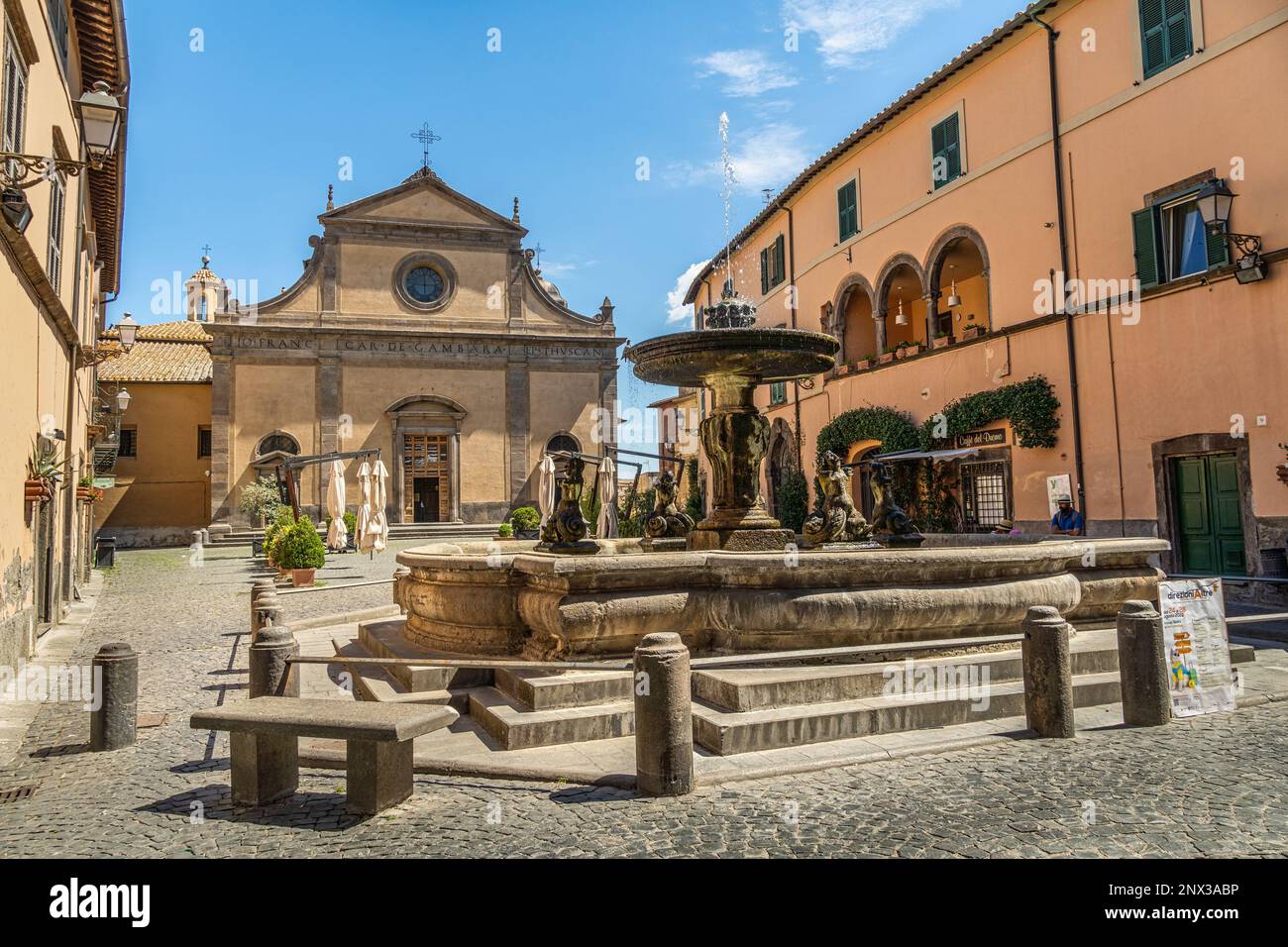 The Fontana Grande and the Tuscania cathedral dedicated to San Giacomo Maggiore in Domenico Bastianini square in Tuscania. Province of Viterbo, Lazio Stock Photo