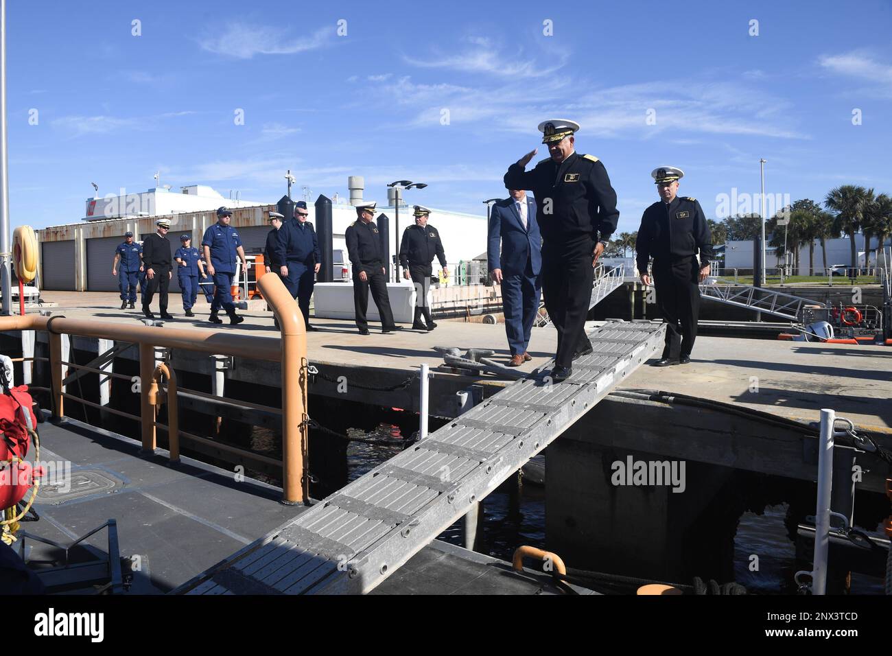230207-N-DB801-0516  MAYPORT, Fla. - (Feb. 7, 2023) — Ecuadorian Navy Rear Adm. Jaime Patricio Vela Erazo, Chief of Staff of the Ecuadorian Navy, offers a salute as he comes aboard the U.S. Coast Guard Cutter Heron (WPB-87344) pierside at U.S. Coast Guard Station Mayport, Feb. 7, 2023. The Ecuadorian Navy tour of U.S. Coast Guard cutter and facilities was in conjunction with U.S. Naval Forces Southern Command and U.S. Navy 4th Fleet bilateral Maritime Staff Talks, which support U.S. joint and combined maritime strategy by building and strengthening working relationships with U.S. and partner n Stock Photo