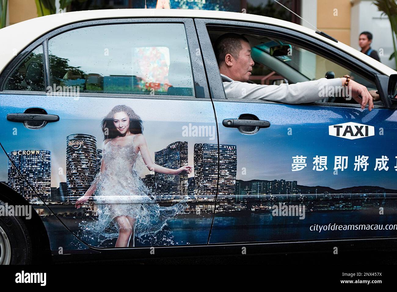 Taxi With advertisement of city of dreams,Macau,China Stock Photo