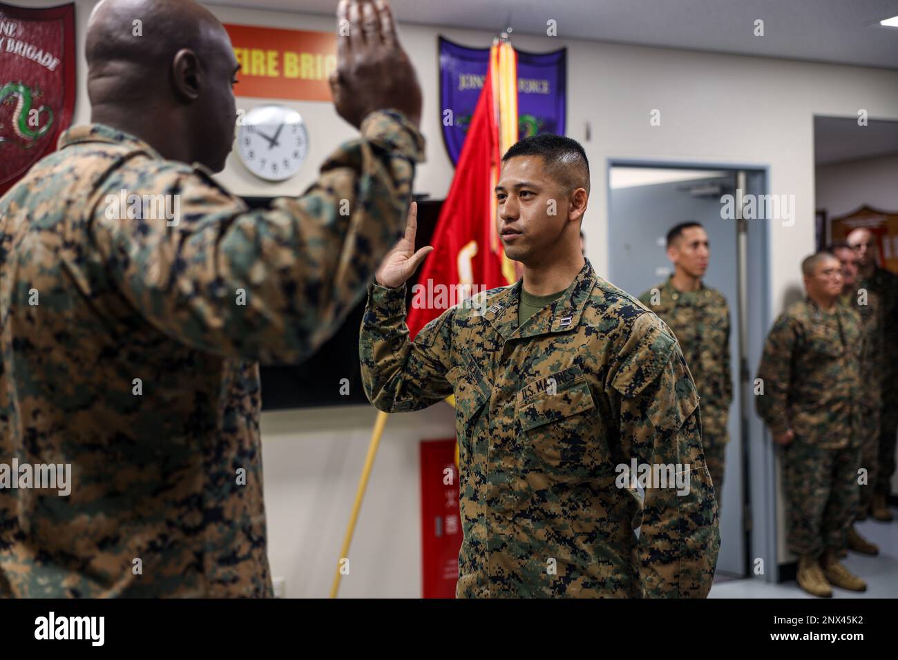 U.S. Marine Capt. Naro Neang, a military police officer with 3rd Marine Expeditionary Brigade, III Marine Expeditionary Force, recites the Oath of Office at his promotion ceremony aboard Camp Courtney, Okinawa, Japan, Feb. 6, 2023. Neang, a native of Modesto, Calif., was commissioned as an officer in the Marine Corps on July 28, 2018, and reported to 3rd MEB on May 5, 2022. He currently serves as the anti-terrorism and force protection officer. Stock Photo