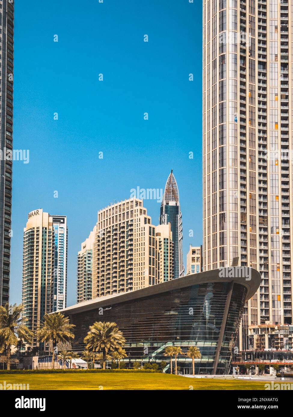 Dubai Opera house in Downtown Dubai, surrounded by skyscrapers and Burj ...